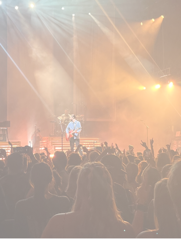 A crowd of people in the air at an event.